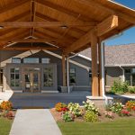 Visitors enter the building under the beautiful natural wood canopy that protects arriving patients and guests from the elements.