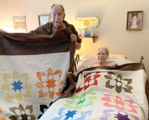Jerry and Pat with quilts