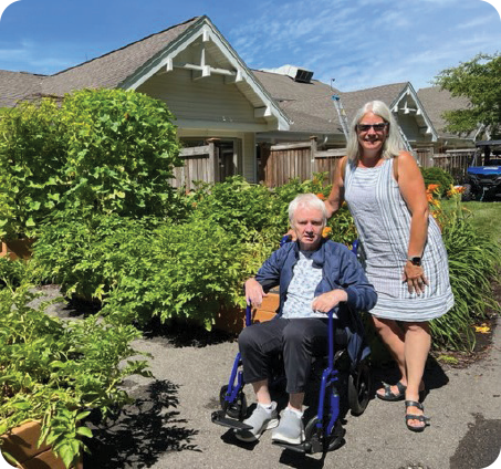 Rick Johnson and his wife, Stephanie, in the Agrace kitchen gardens he helped to create. 