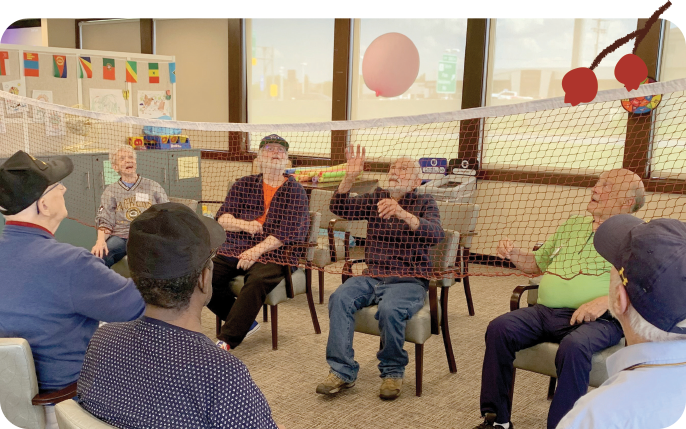 Clients enjoy balloon volleyball at the Adult Day Center