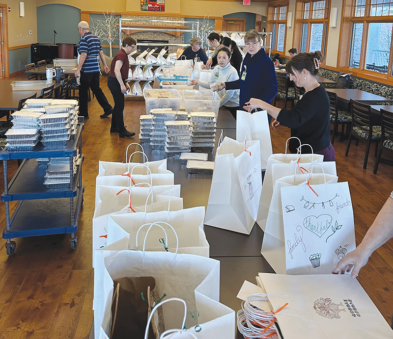 Agrace staff packing Thanksgiving meals to be delivered to patients